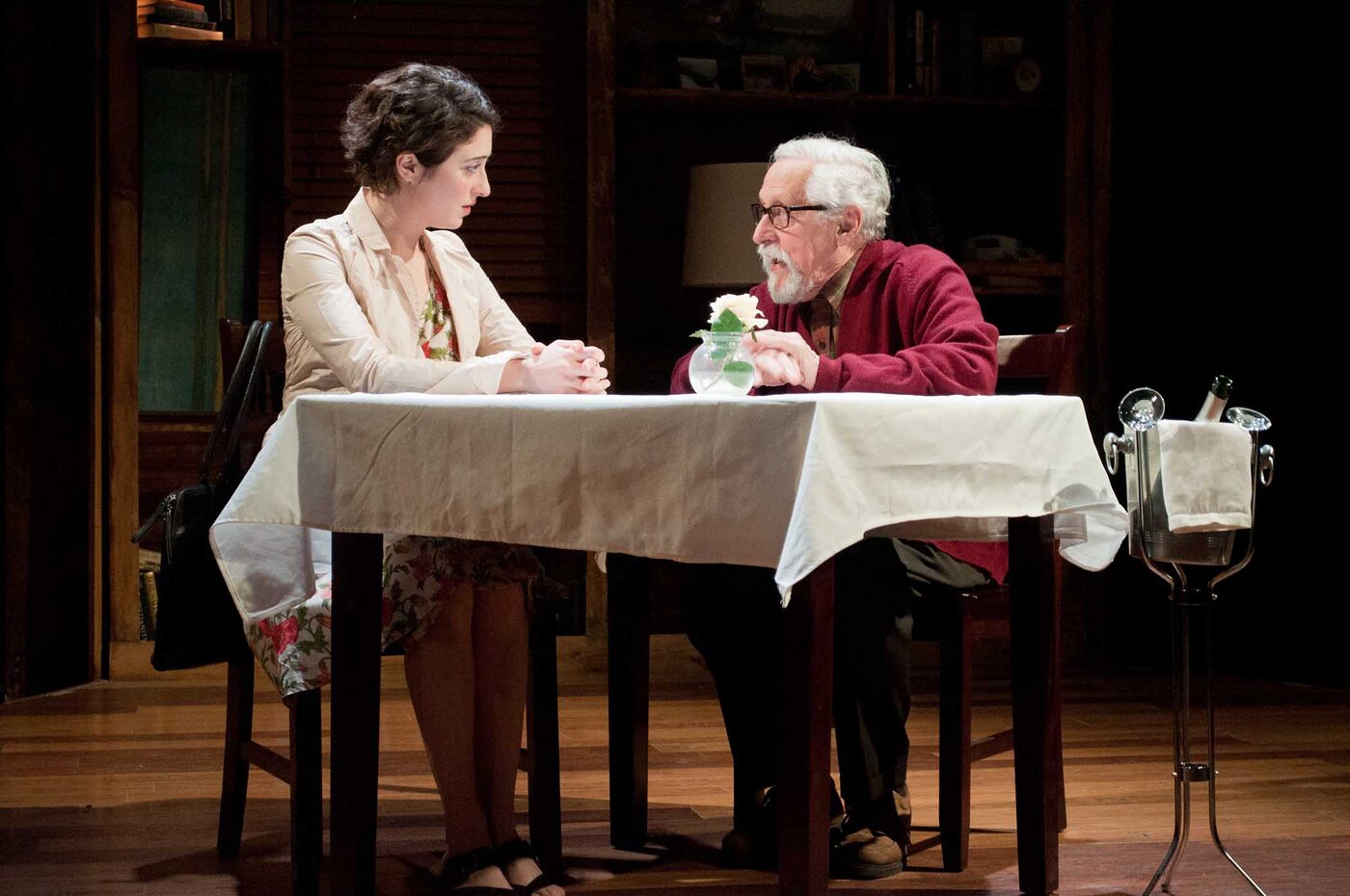 A young woman and an older man share a restaurant table in After the Revolution
