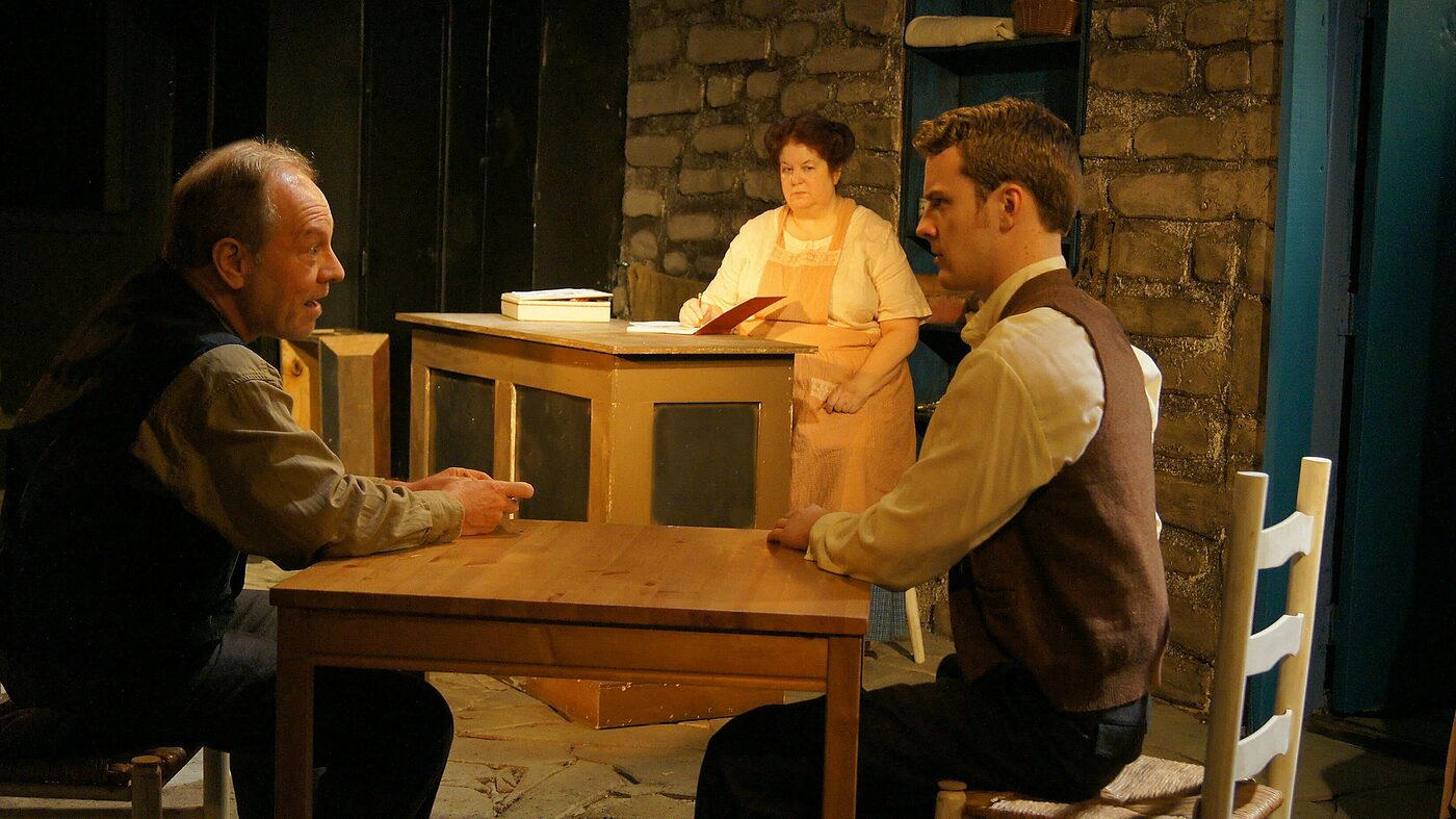 Three characters in the stone-cottage shop of The Cripple of Inishmaan
