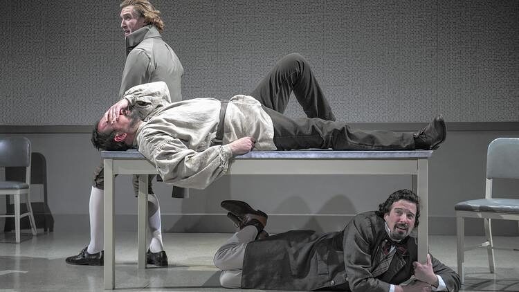 Two men sprawled across a long table in Discord