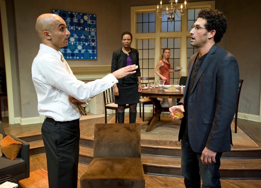 Four actors in the living-room set of Disgraced