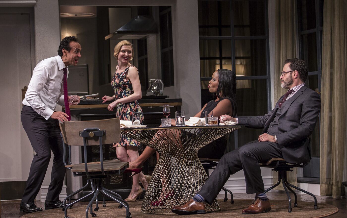 Four characters around the dining table in Disgraced