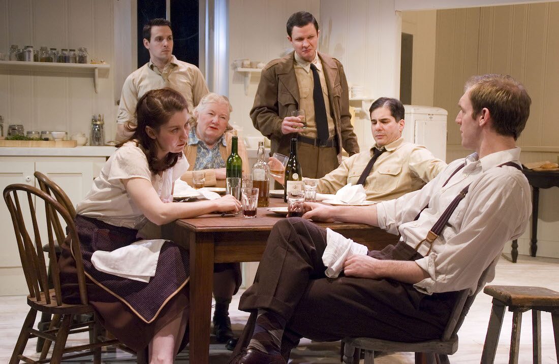 The company gathered around the kitchen table in Dolly West's Kitchen