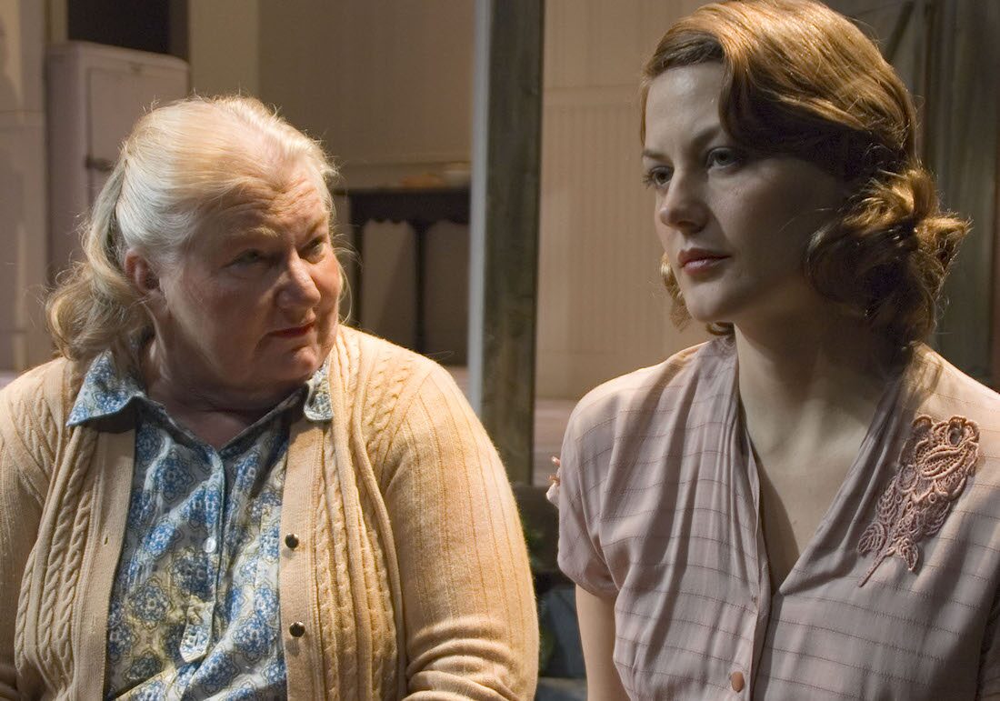 Two actors in a quiet moment in Dolly West's Kitchen