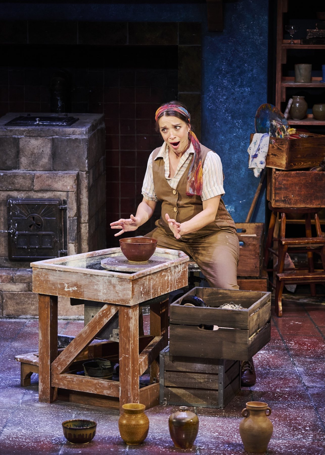 Alex Finke as Marie-Berthe Cazin at the potter's wheel, surrounded by finished pots