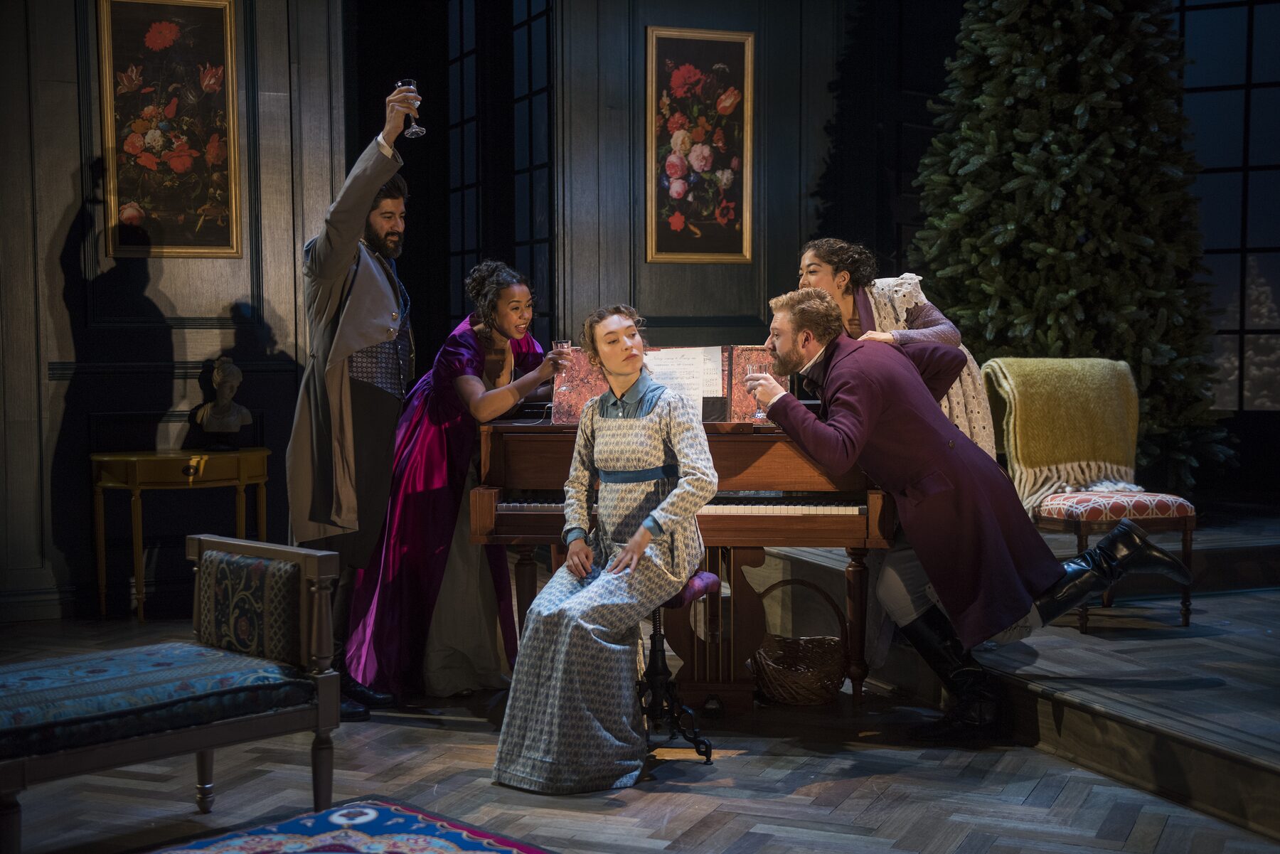 The company gathered around the piano