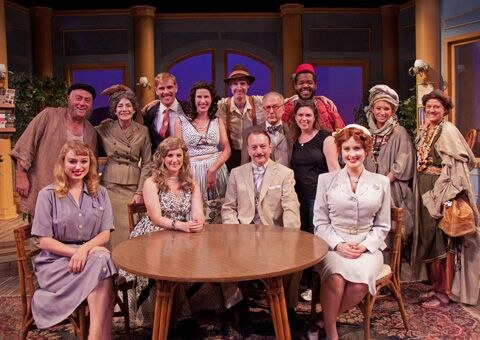 The company of Murder on the Nile around a table on the steamer deck