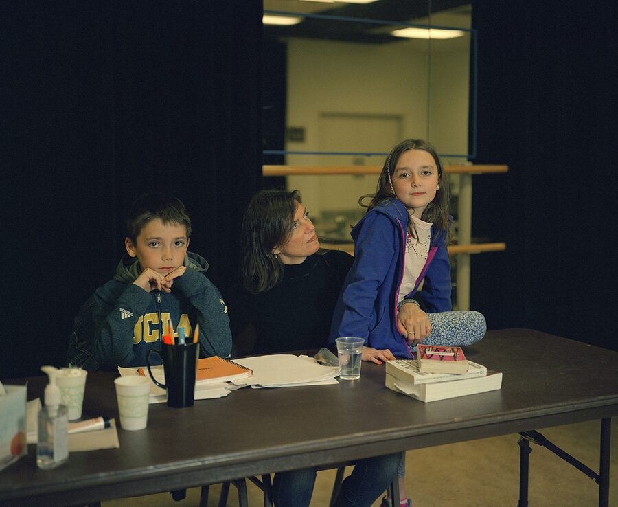 Kimberly Senior with her children, Noah and Delaney, at the rehearsal table during Discord