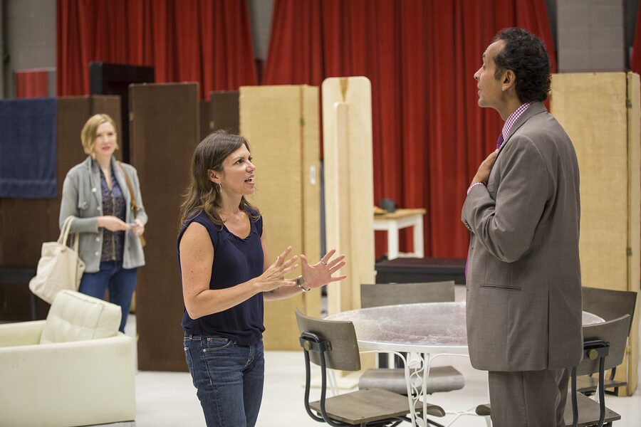 Kimberly Senior talking with an actor on the Disgraced set