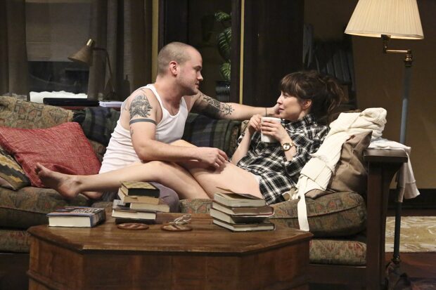 Ethan and Olivia on the sofa of the bed-and-breakfast set in Sex With Strangers