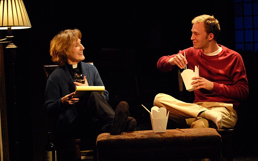 A minister and a young man share takeout and conversation in The Busy World Is Hushed