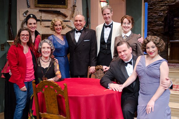 The company of The Game's Afoot gathered around a dinner table in William Gillette's castle