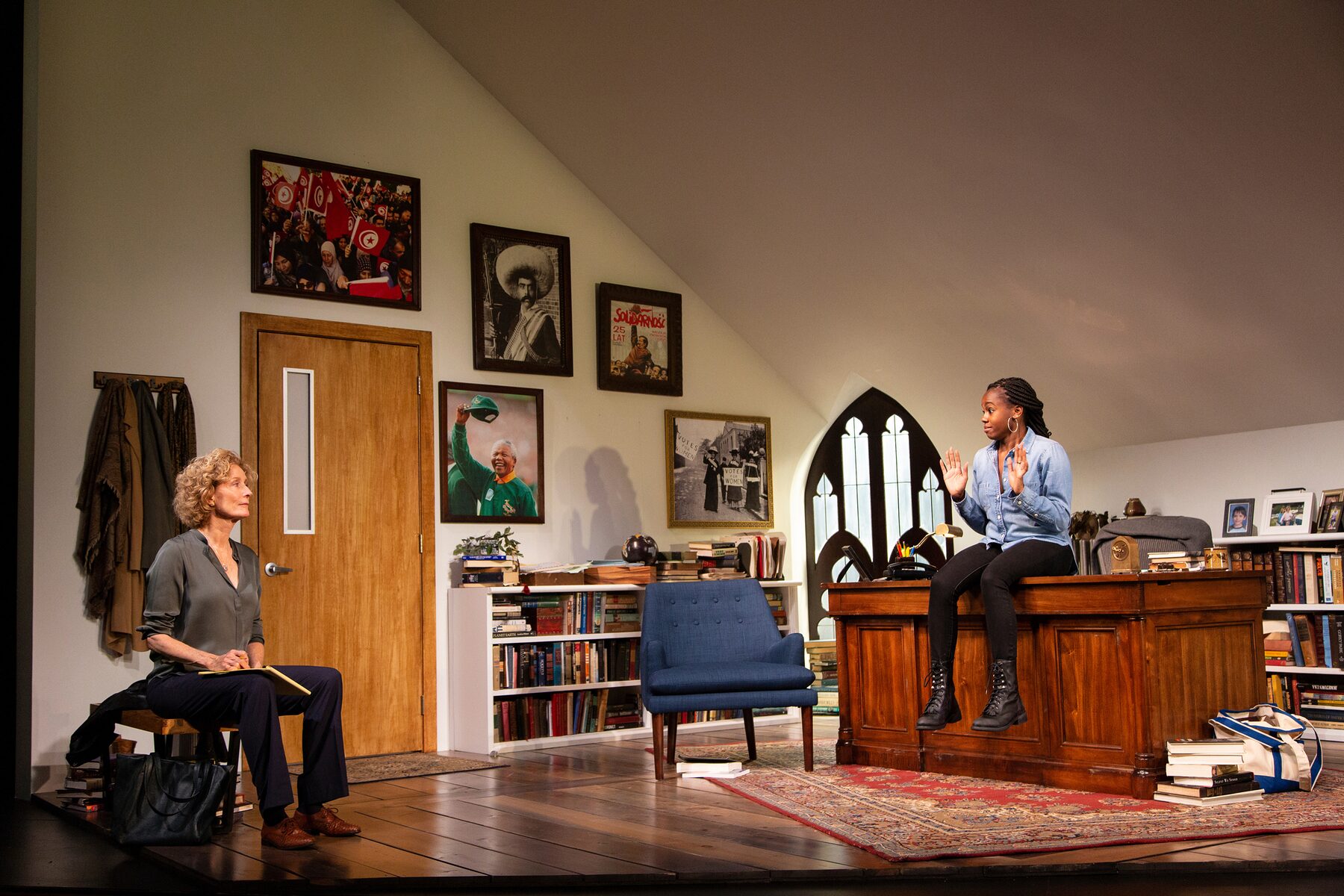 The full office set, with the professor seated at left and the student perched on the desk