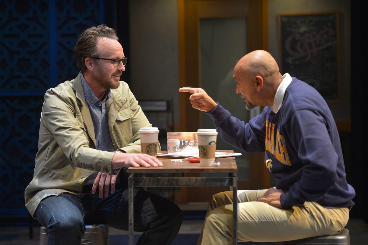 Two men arguing over coffee in The Who & The What